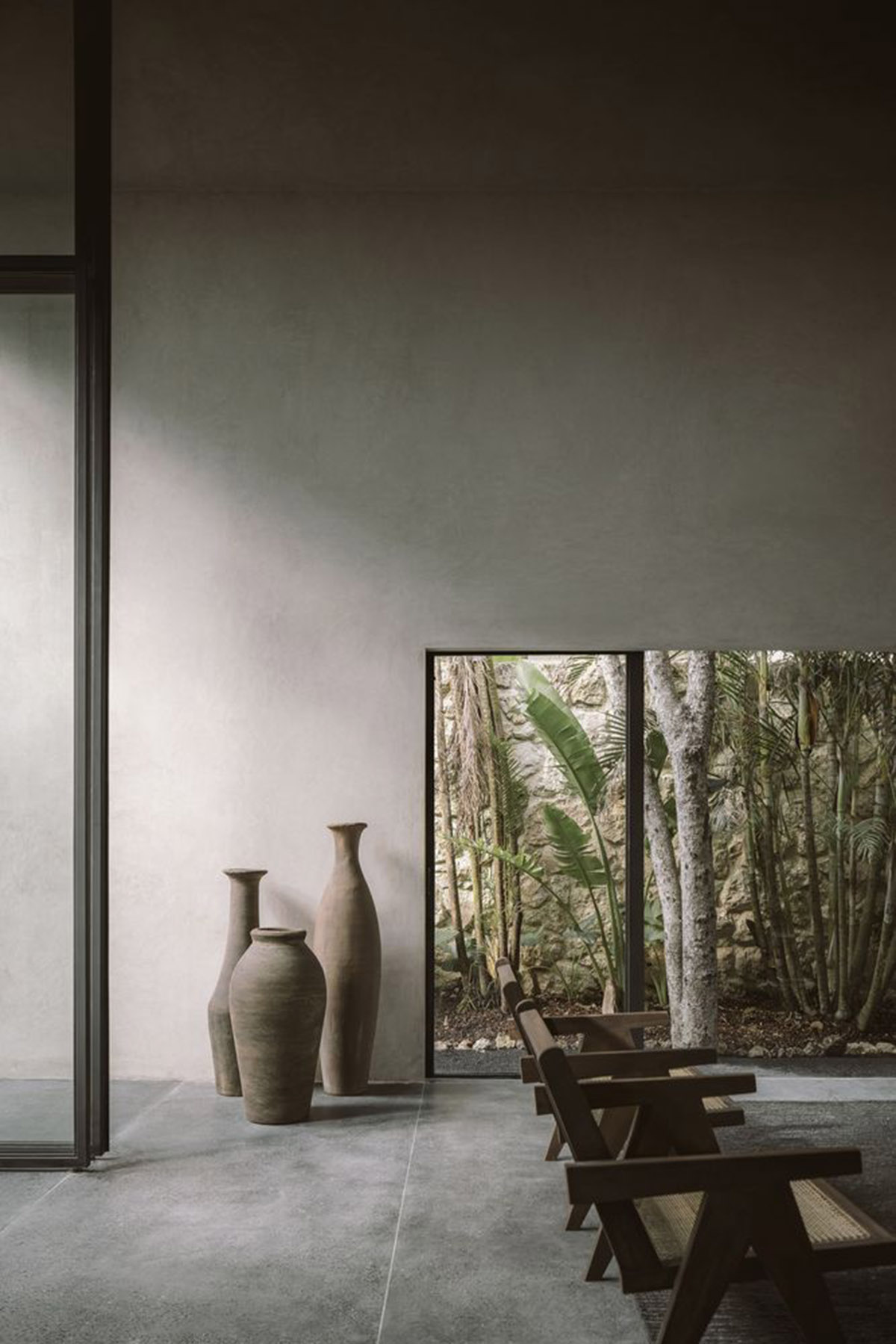 CO-LAB Design Office built concrete villa framing a lush jungle in Tulum