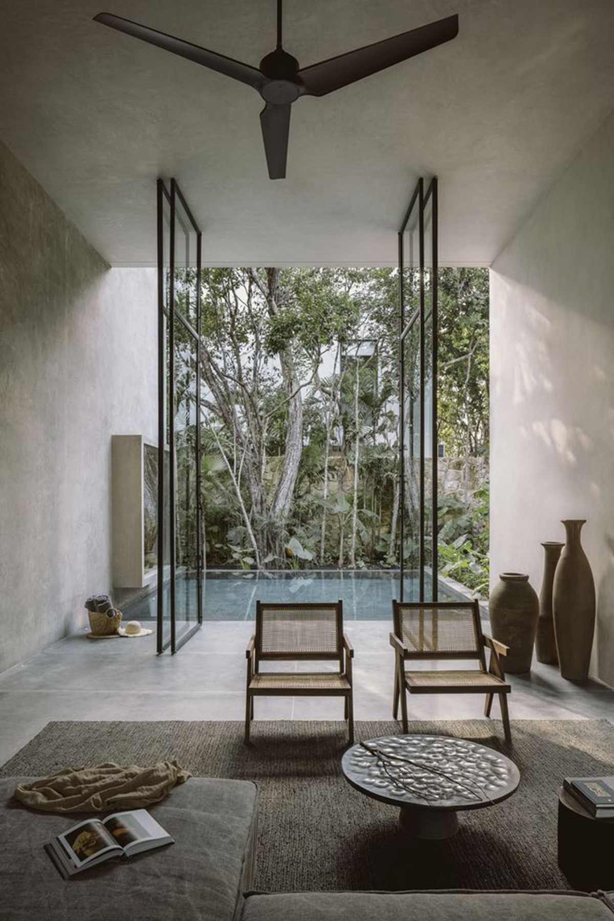 CO-LAB Design Office built concrete villa framing a lush jungle in Tulum