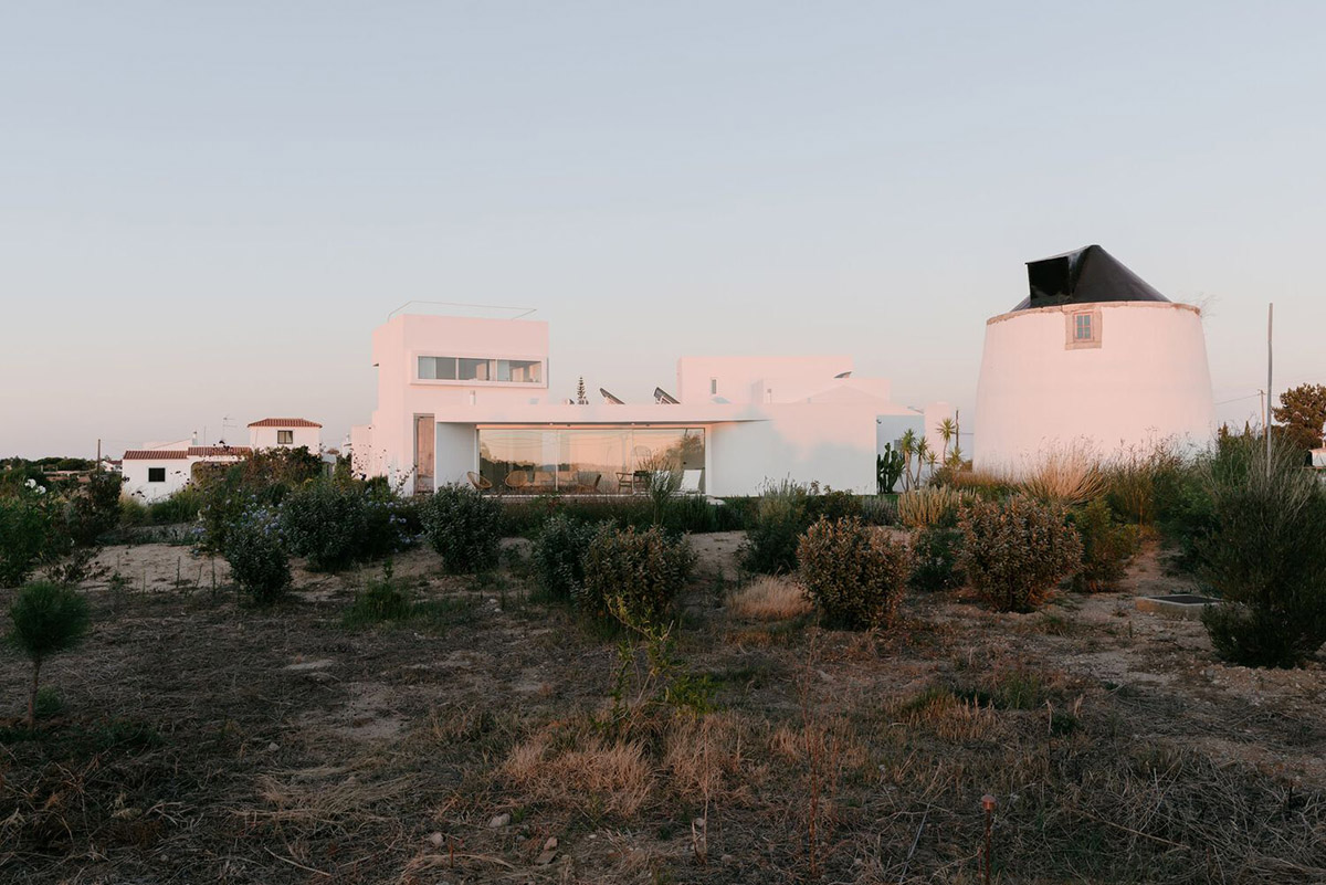 Portuguese holiday home is shaped around private patios and low-rise volumes in Algarve region