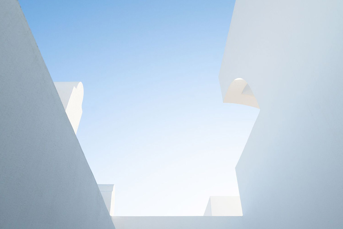 Portuguese holiday home is shaped around private patios and low-rise volumes in Algarve region