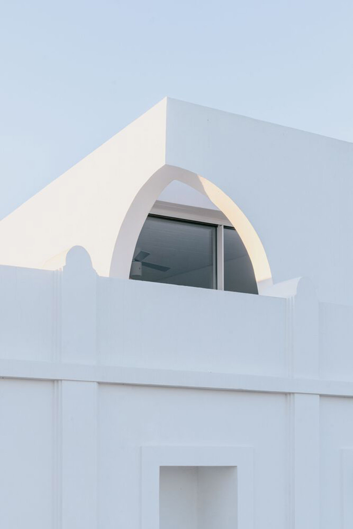 Portuguese holiday home is shaped around private patios and low-rise volumes in Algarve region