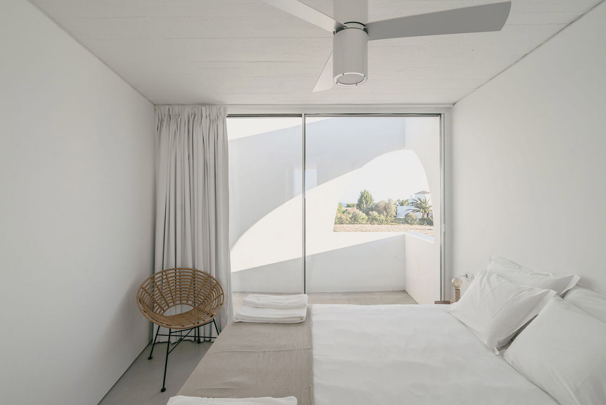 Portuguese holiday home is shaped around private patios and low-rise volumes in Algarve region