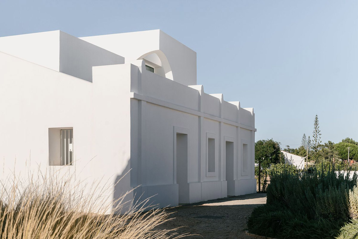 Portuguese holiday home is shaped around private patios and low-rise volumes in Algarve region