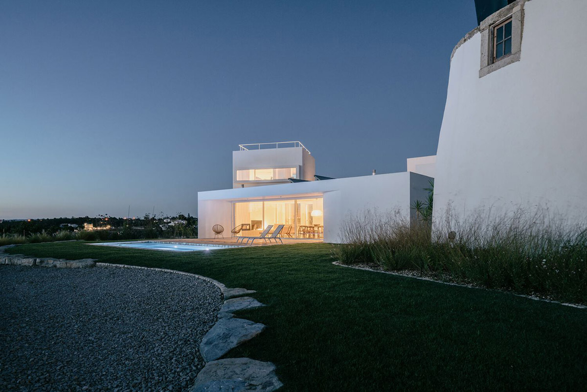 Portuguese holiday home is shaped around private patios and low-rise volumes in Algarve region