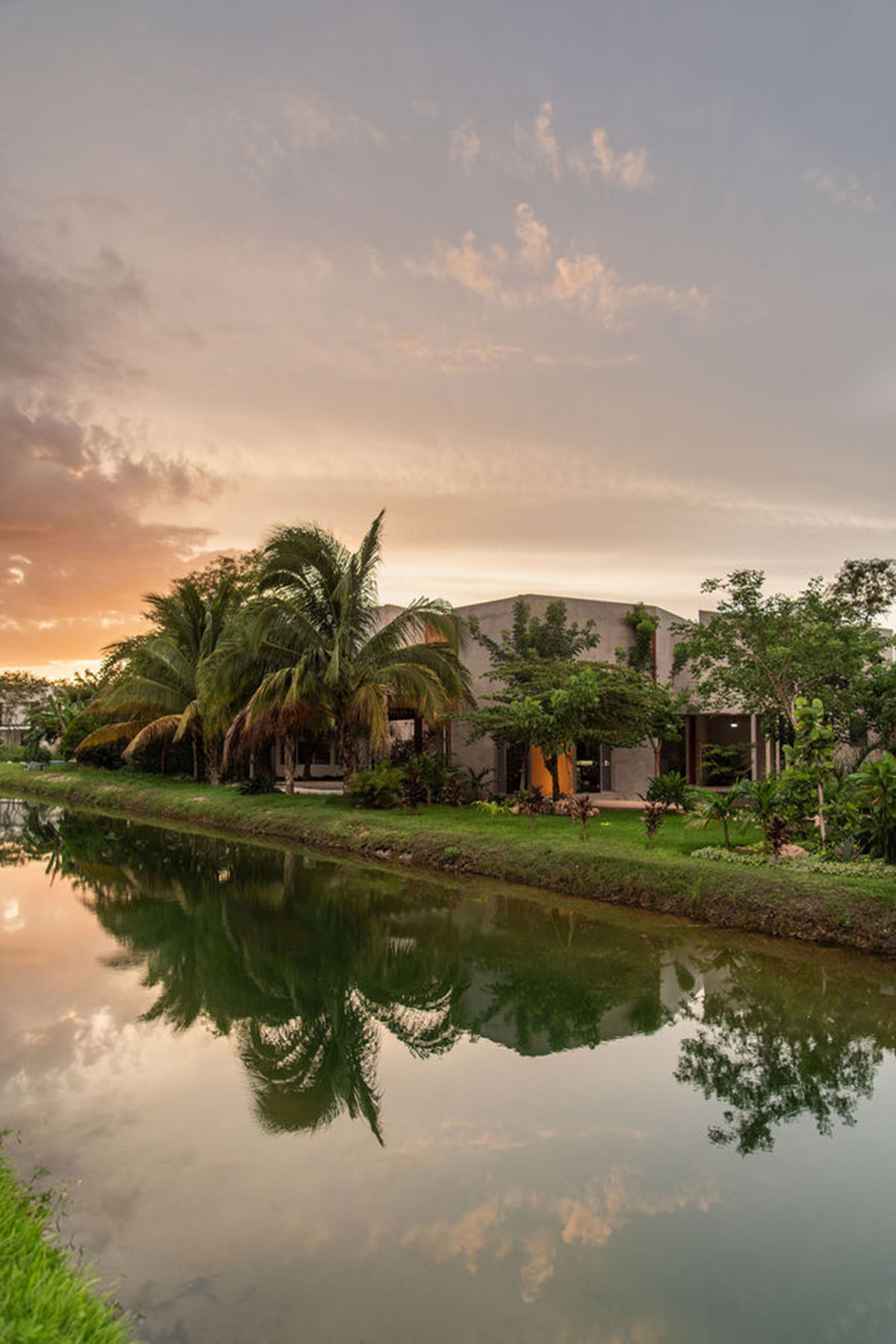 Natural-toned detached house by TACO features dynamic open spaces and backyards in Mexico