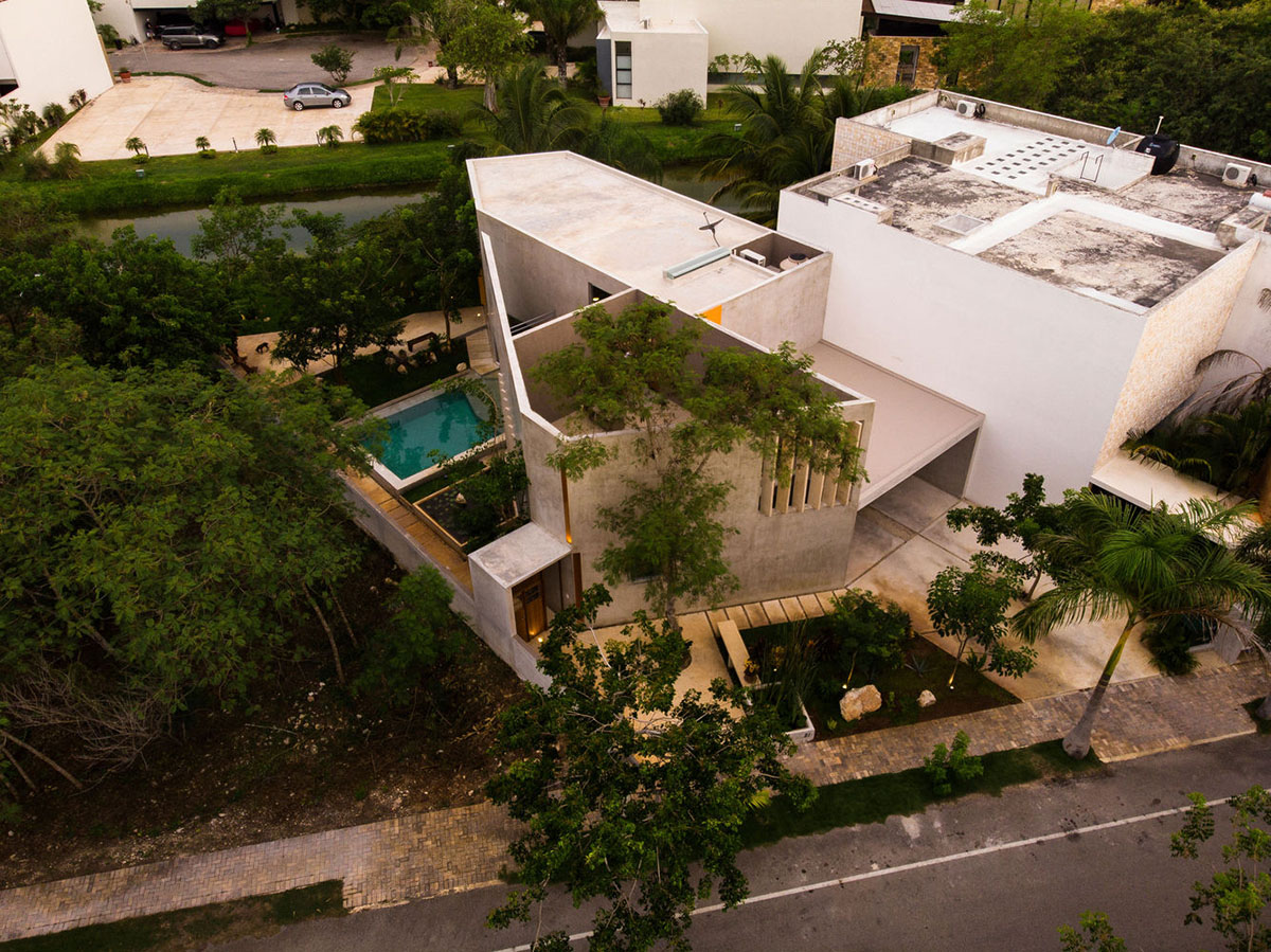 Natural-toned detached house by TACO features dynamic open spaces and backyards in Mexico