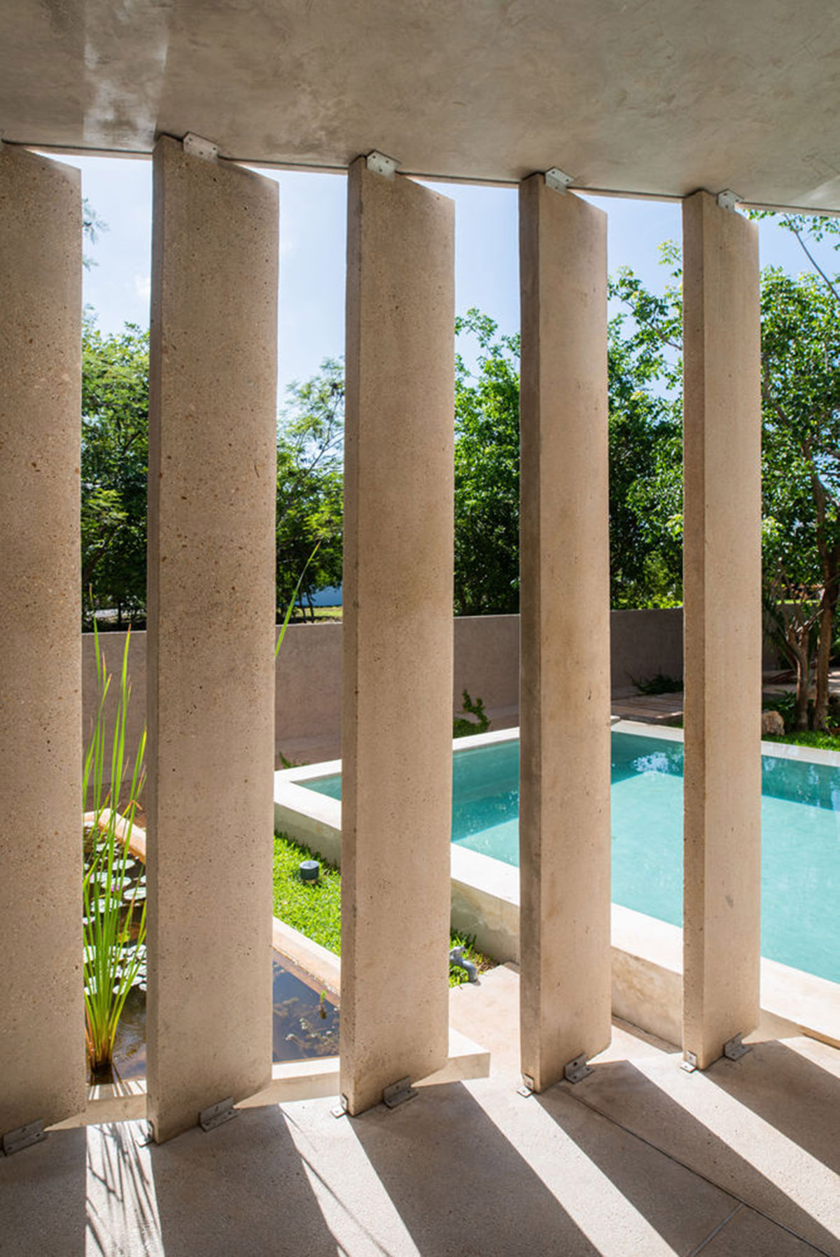 Natural-toned detached house by TACO features dynamic open spaces and backyards in Mexico