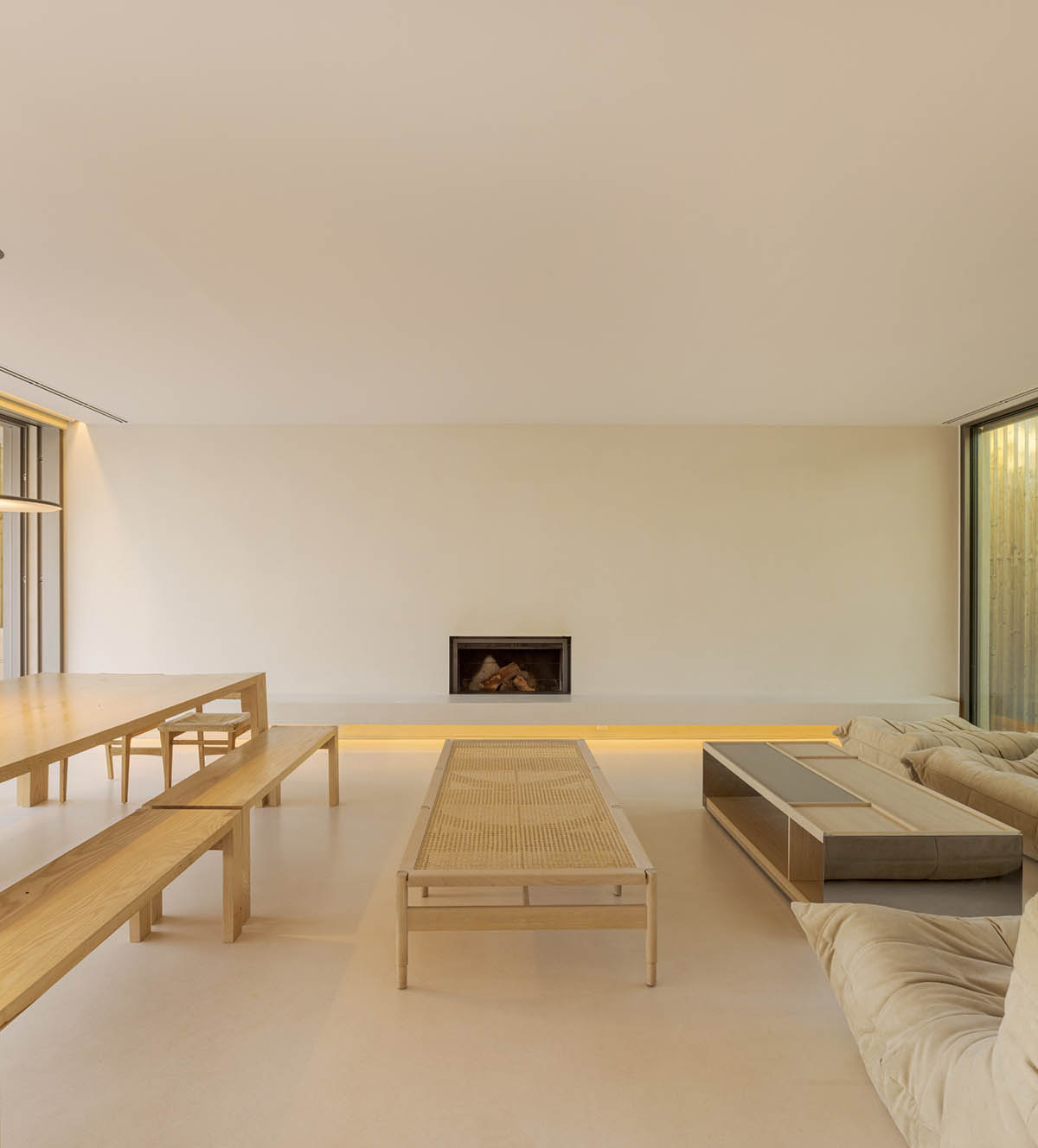 Palisade House is wrapped by a long palisade in fir wood to protect dunes in Troia, Portugal 