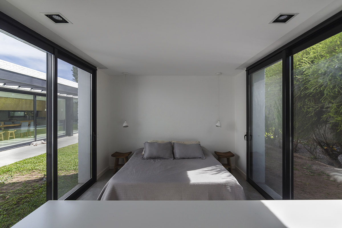 Nomade Architecture completes family house enveloped by white brick walls in Argentina