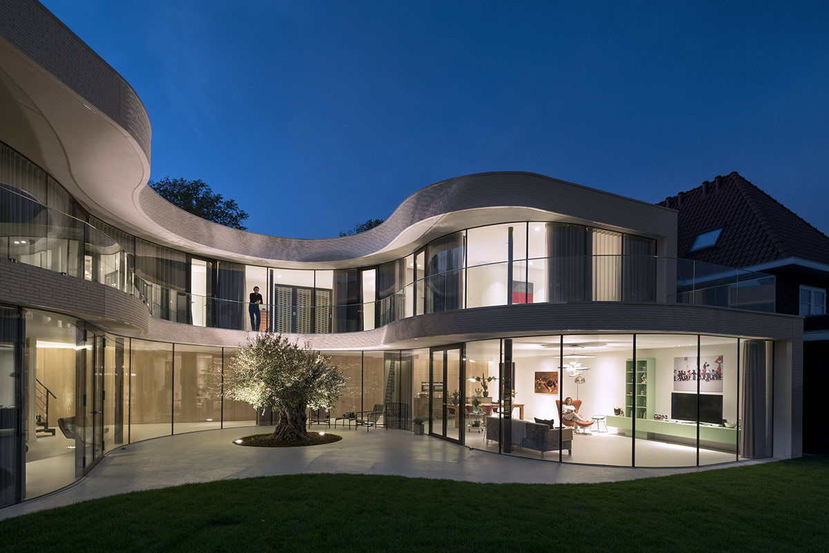 MVRDV completes Casa Kwantes house with fluid glass walls in Rotterdam