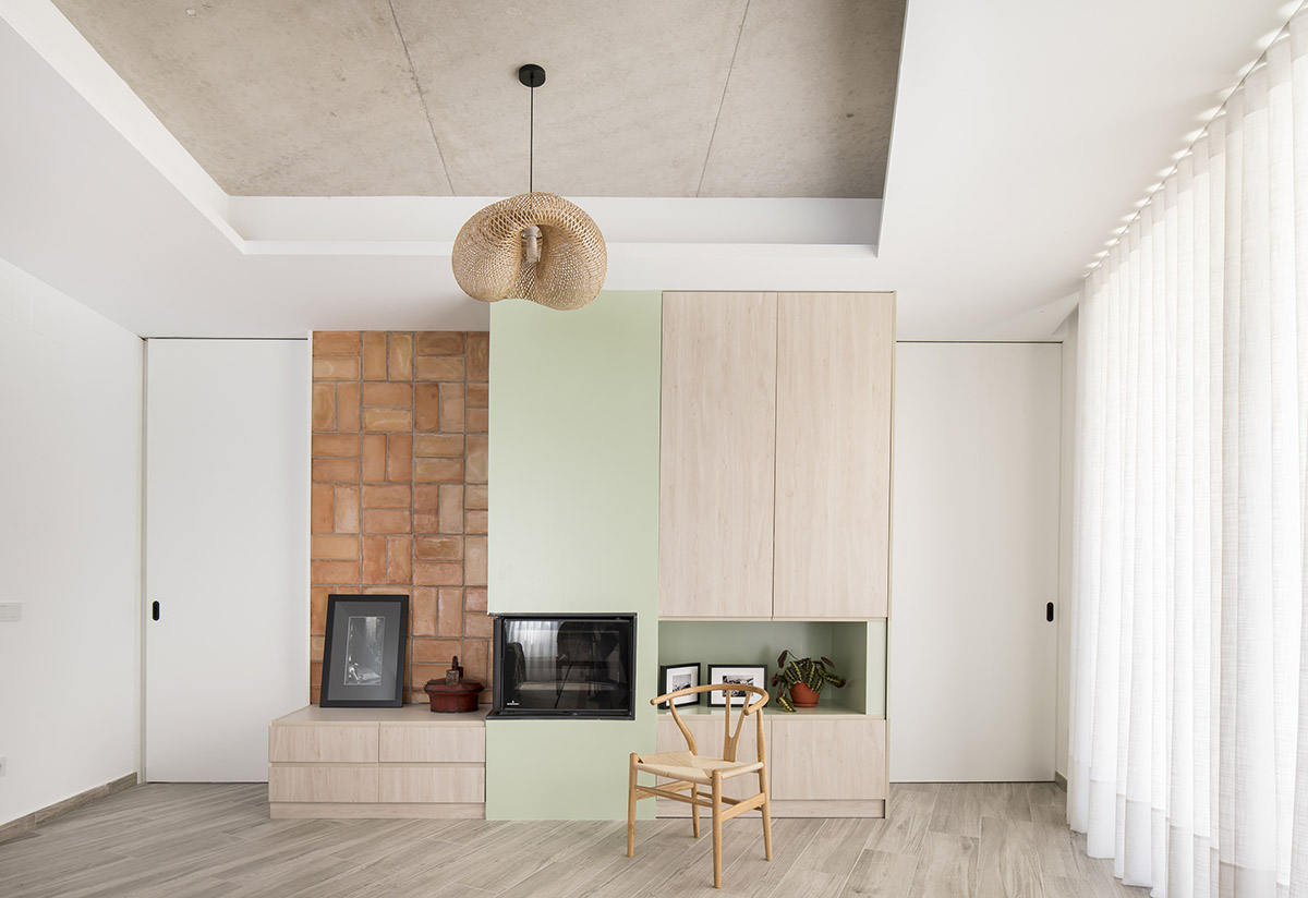 OOIIO Architecture plays with intersection of red ceramic-tiled volumes to create house in Madrid