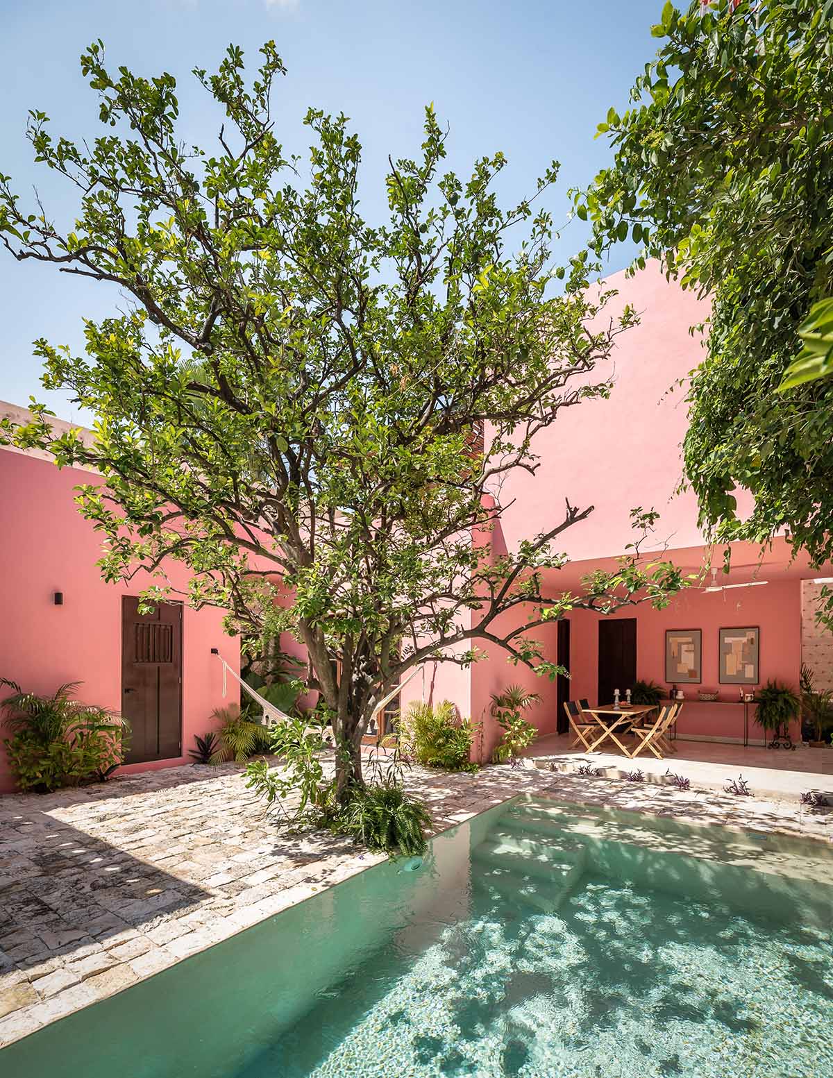 Workshop, Diseño y Construcción combines historic elements with Mexican pink in Casa Maca 