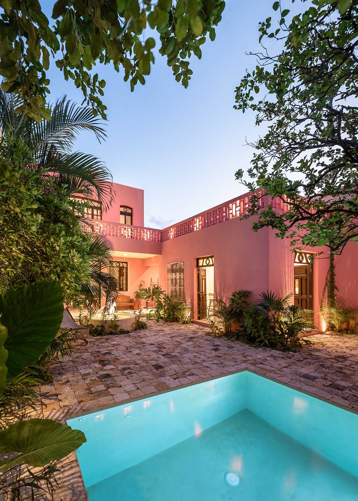 Workshop, Diseño y Construcción combines historic elements with Mexican pink in Casa Maca 