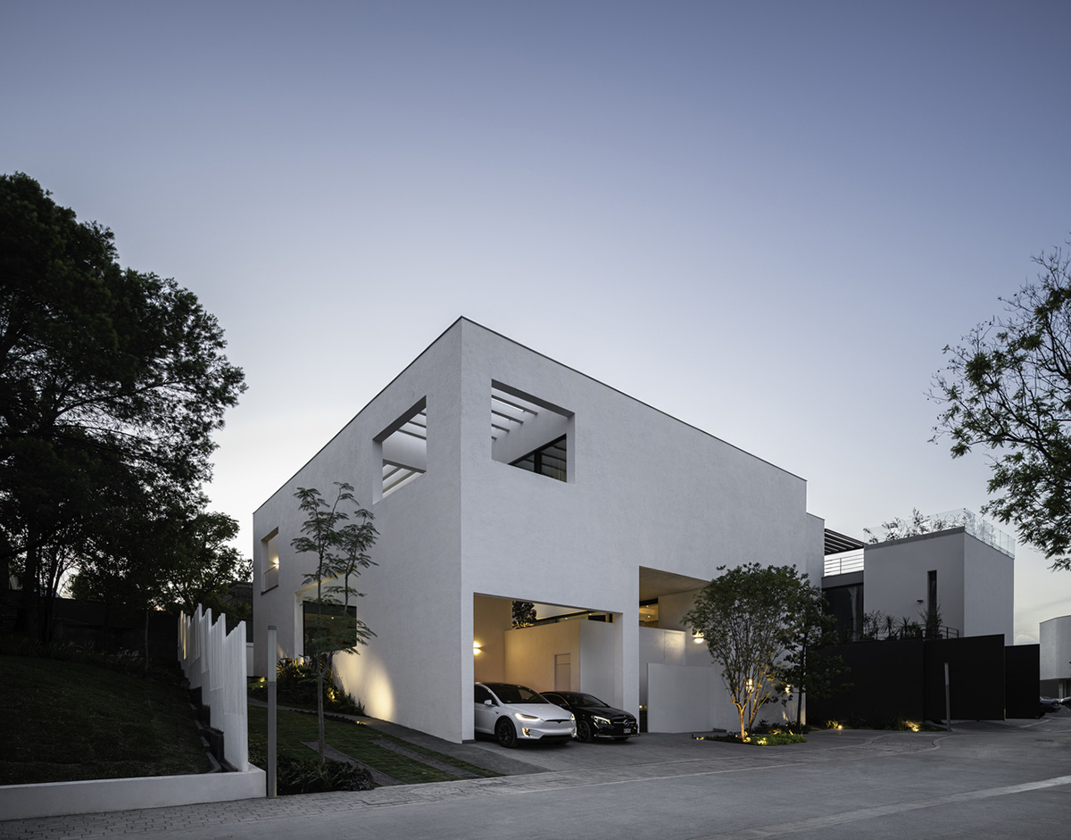 Cadaval & Solà-Morales' white excavated house features porous interior that expands activities