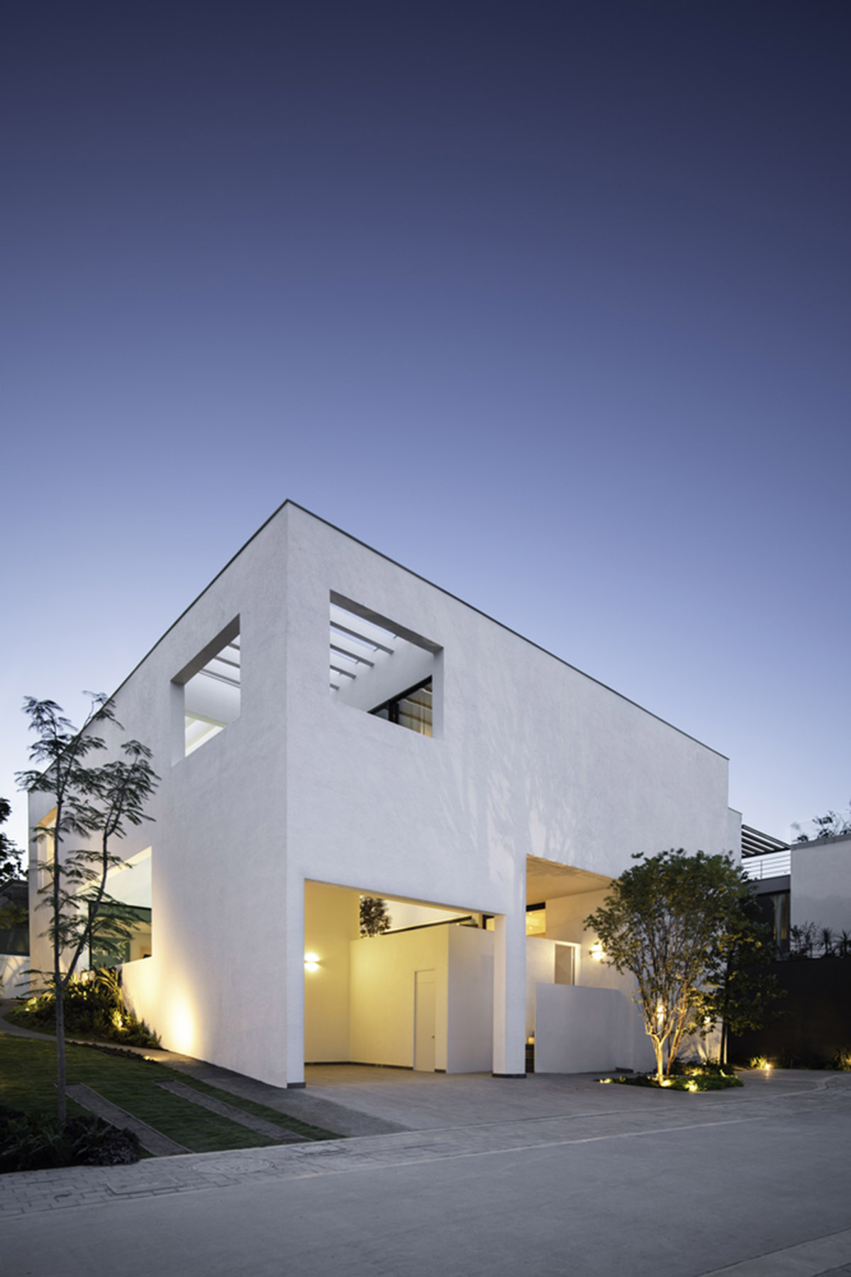 Cadaval & Solà-Morales' white excavated house features porous interior that expands activities