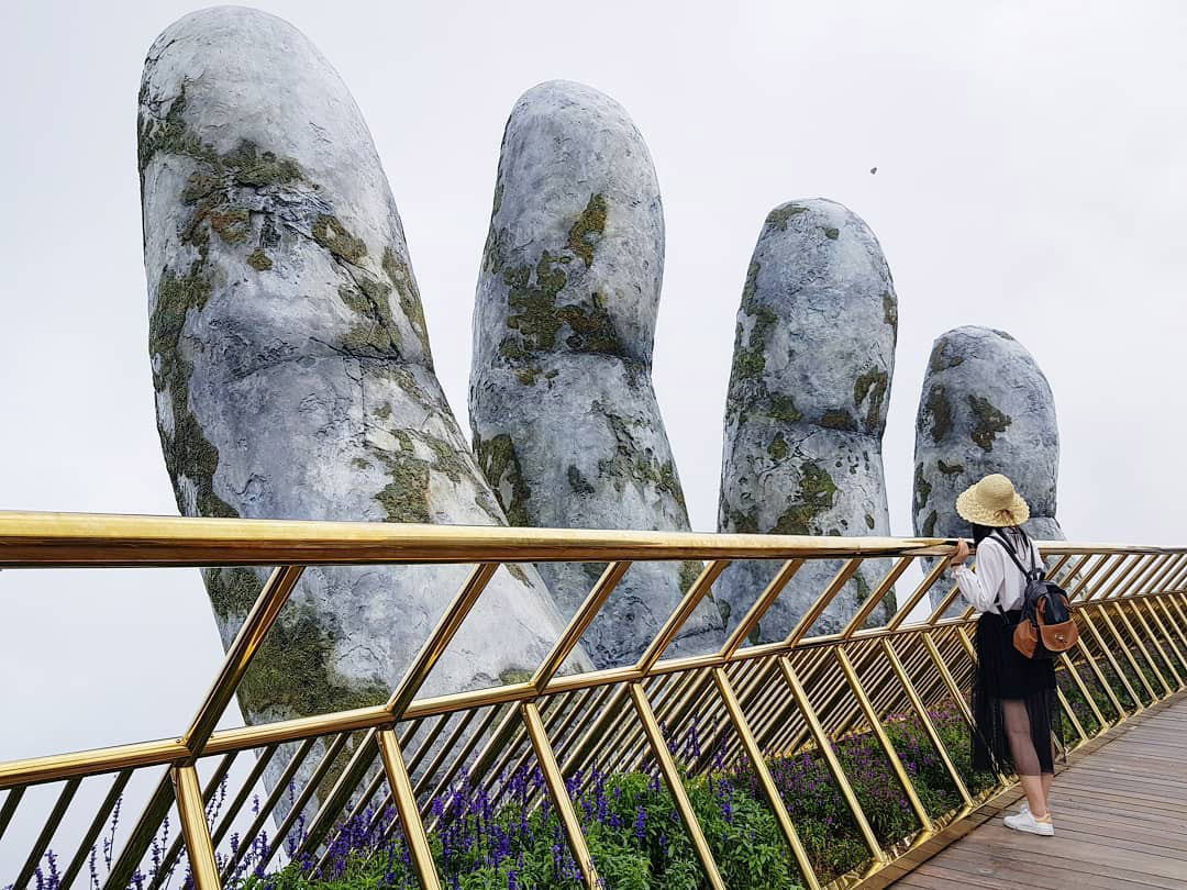 A Giant Pair of Hands Lifts This Vietnamese Bridge into the Sky