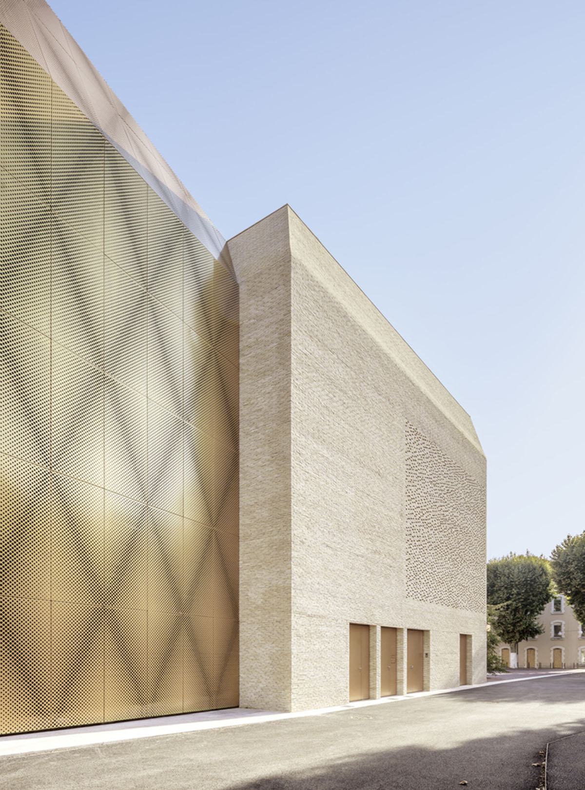 Grand Palais Cinema by Antonio Virga Architecte features perforated brickwork on façade in France