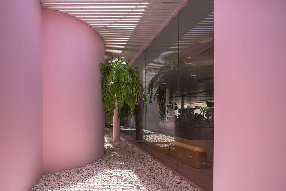 onion combines white concave and convex walls with colorful surfaces for beach resort in Thailand