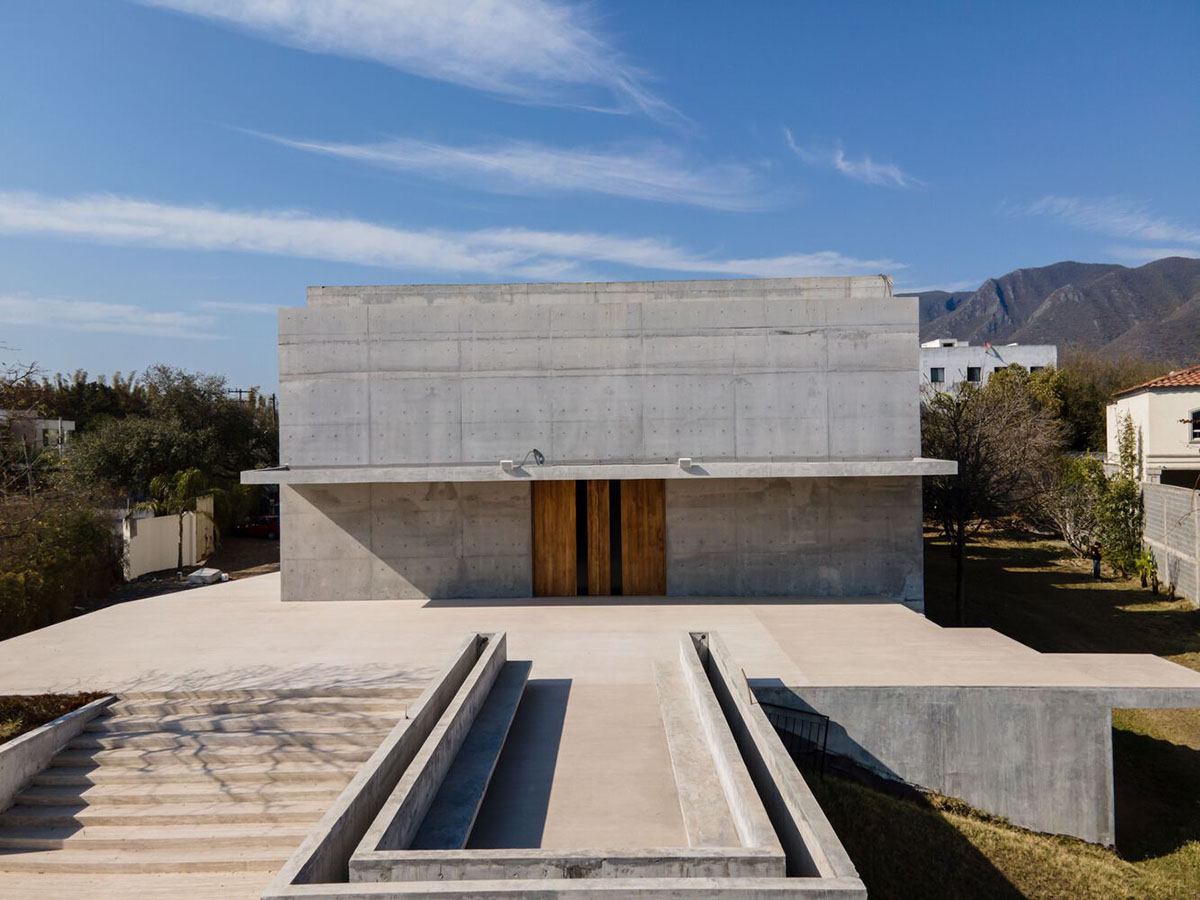 Sliced concrete walls create rhythm and allow abundant natural light ...