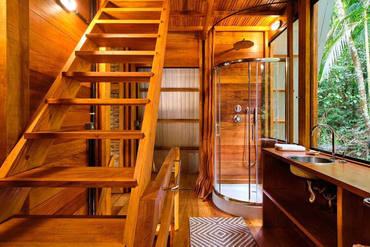 Macaco House is lifted on pillars to have zero interference in vegetation of Brazilian forest