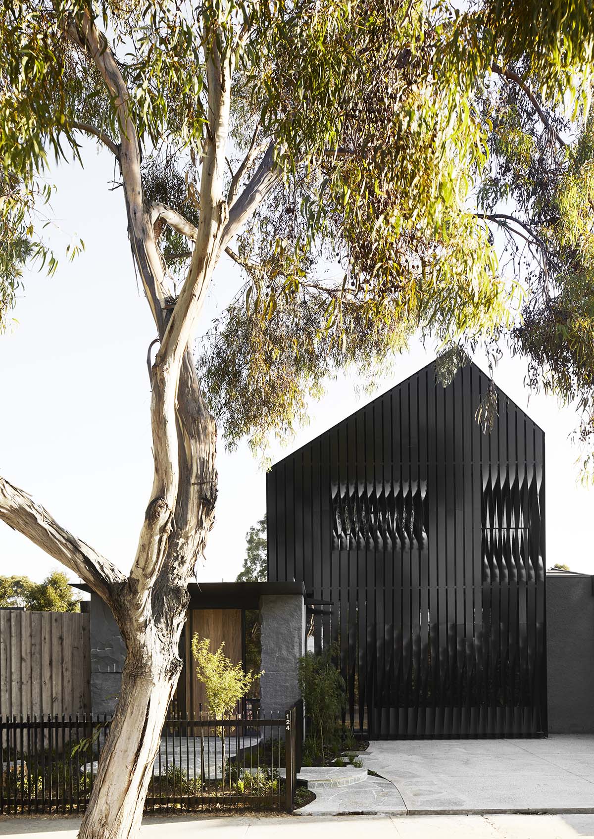 Splinter Society Architecture clads Cornerstone House with blackened timber slats in Australia