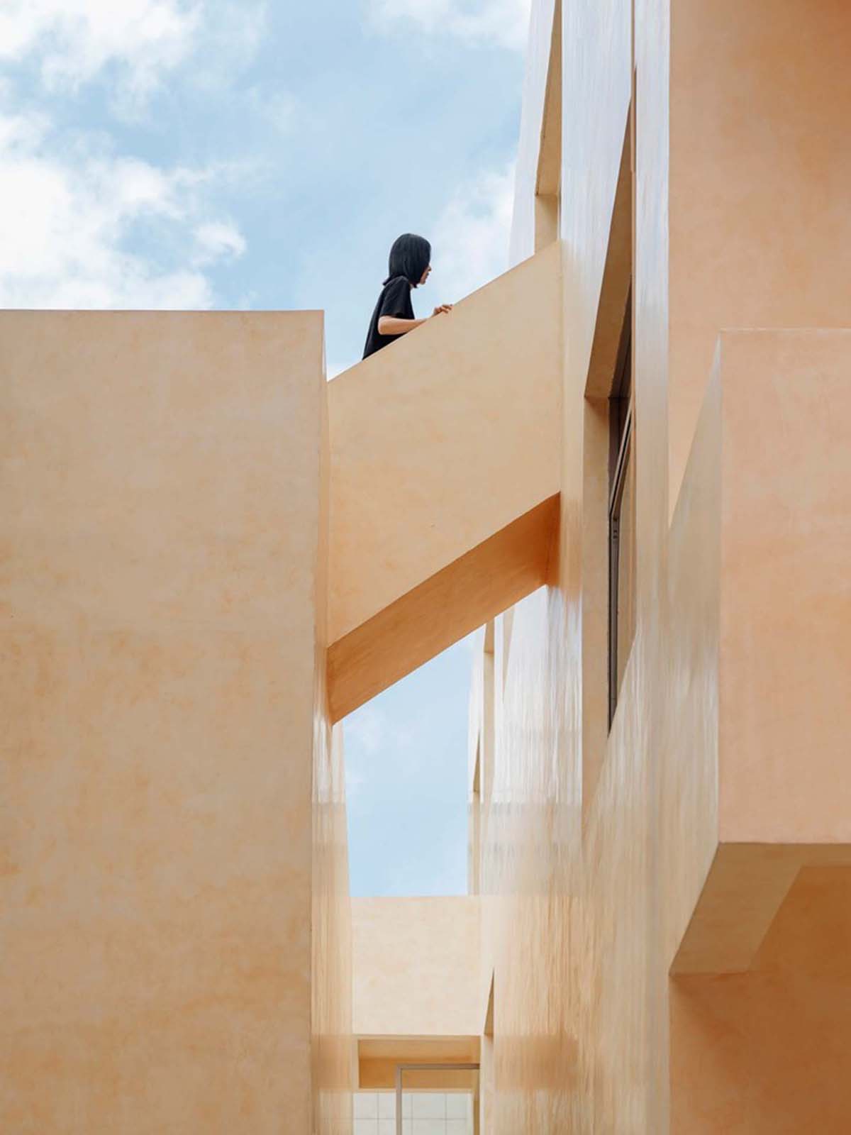 Ladder-Like sandalwood yellow volumes form Buddha artist's exhibition space and studio in China