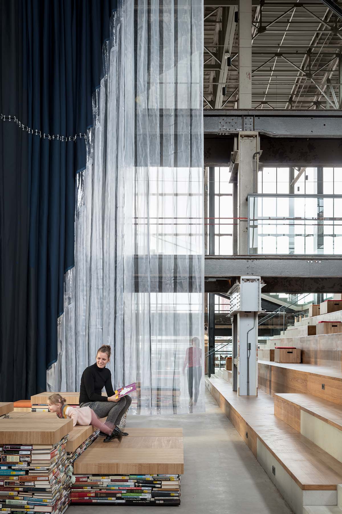 Civic Architects transforms old industrial building into a transparent public library in Tilburg