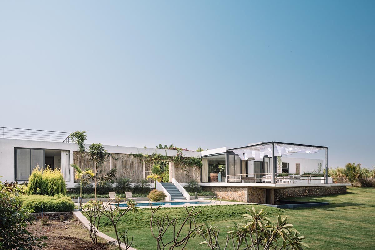 Weekend home is clad in bamboo screens that create a rustic appearance on the outskirts of Pune