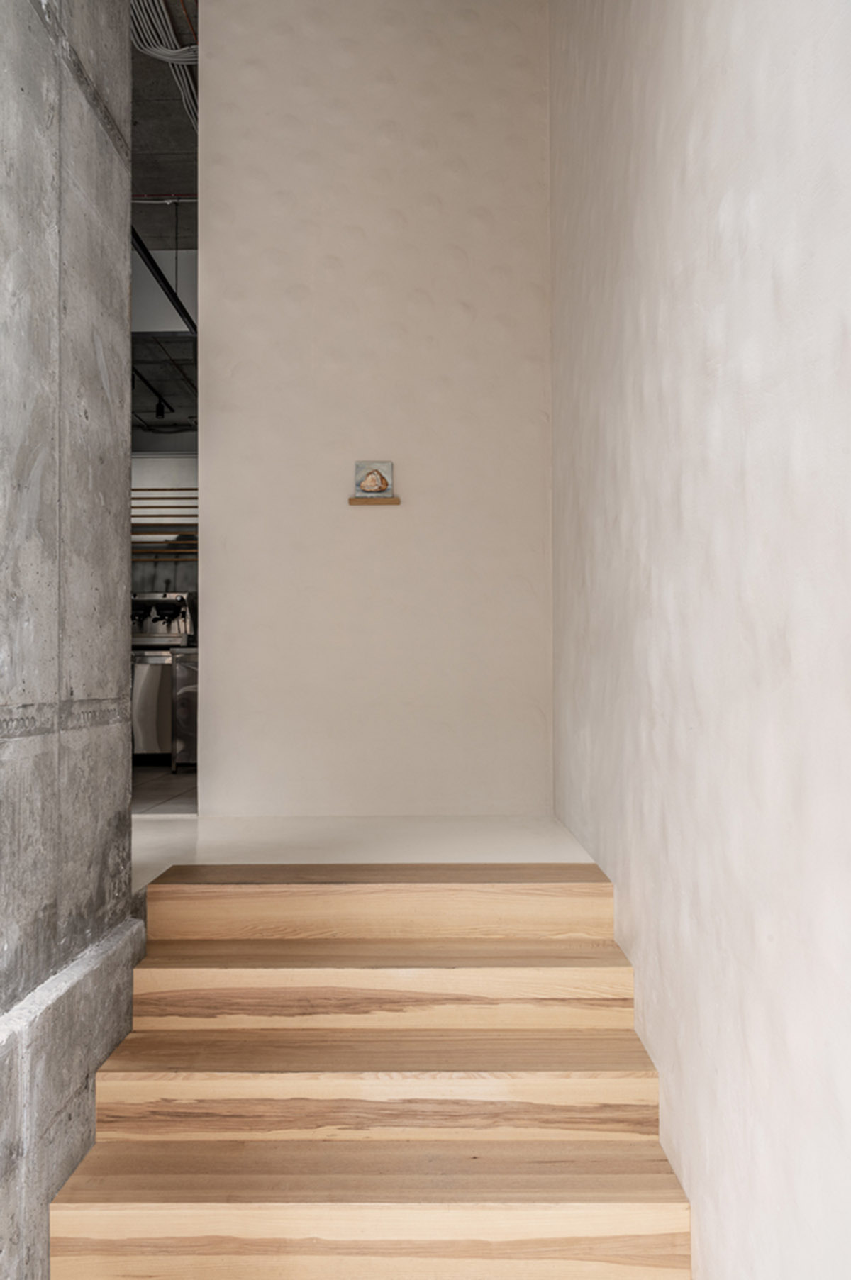 Earth-toned materials and soft lines form interiors of this ready-to-eat food restaurant in Kyiv