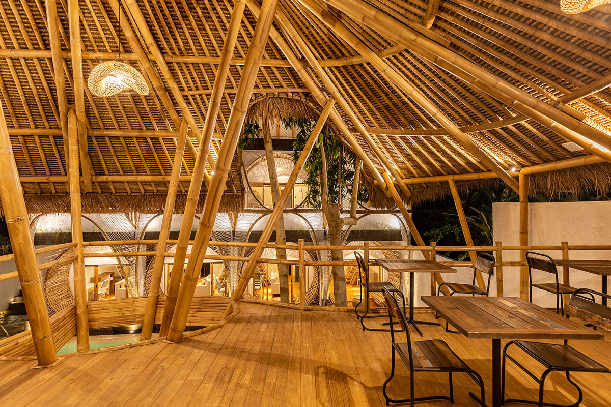 Ruang Nyaman creates intricate facade from arched-bamboo elements for hotel and co-living space