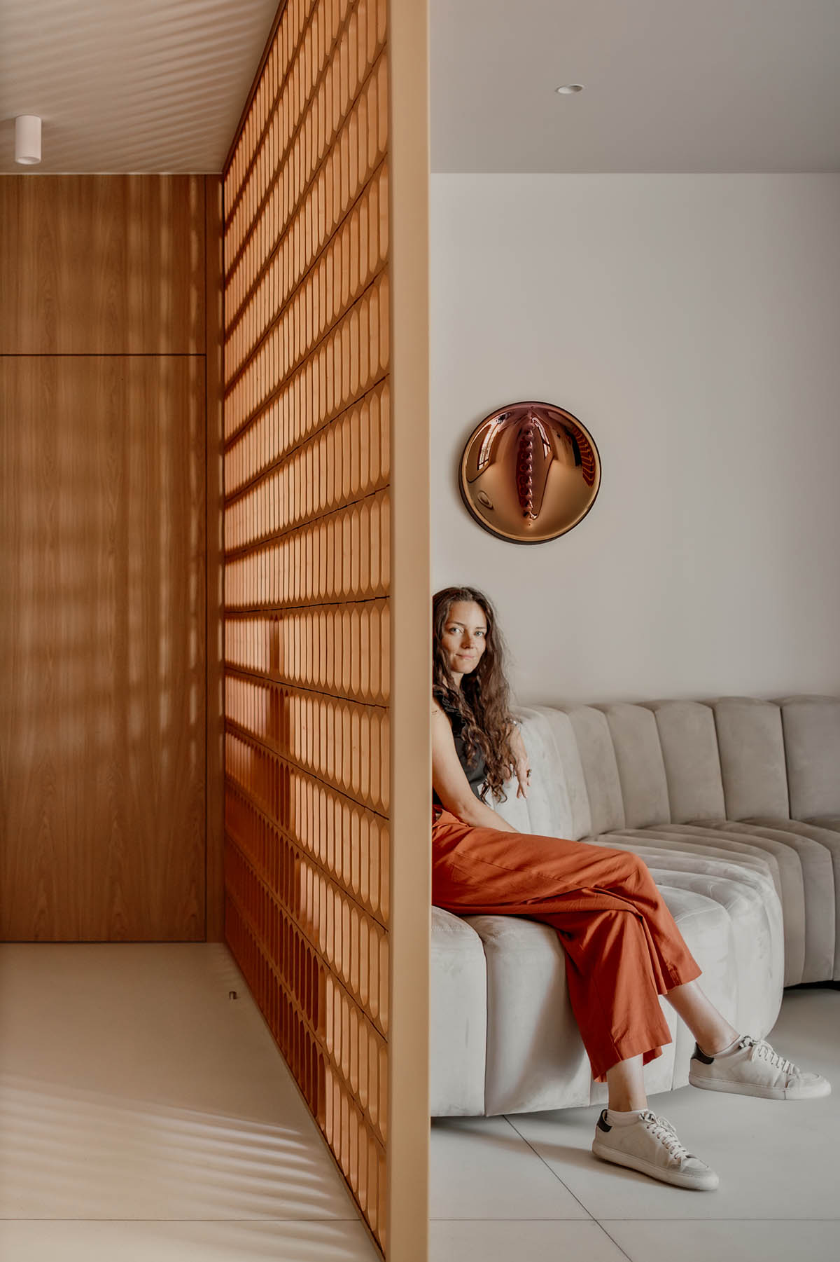 Brise soleil system and clay counter add warmth and depth to dental clinic in Latvia