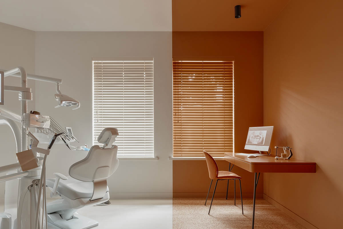 Brise soleil system and clay counter add warmth and depth to dental clinic in Latvia