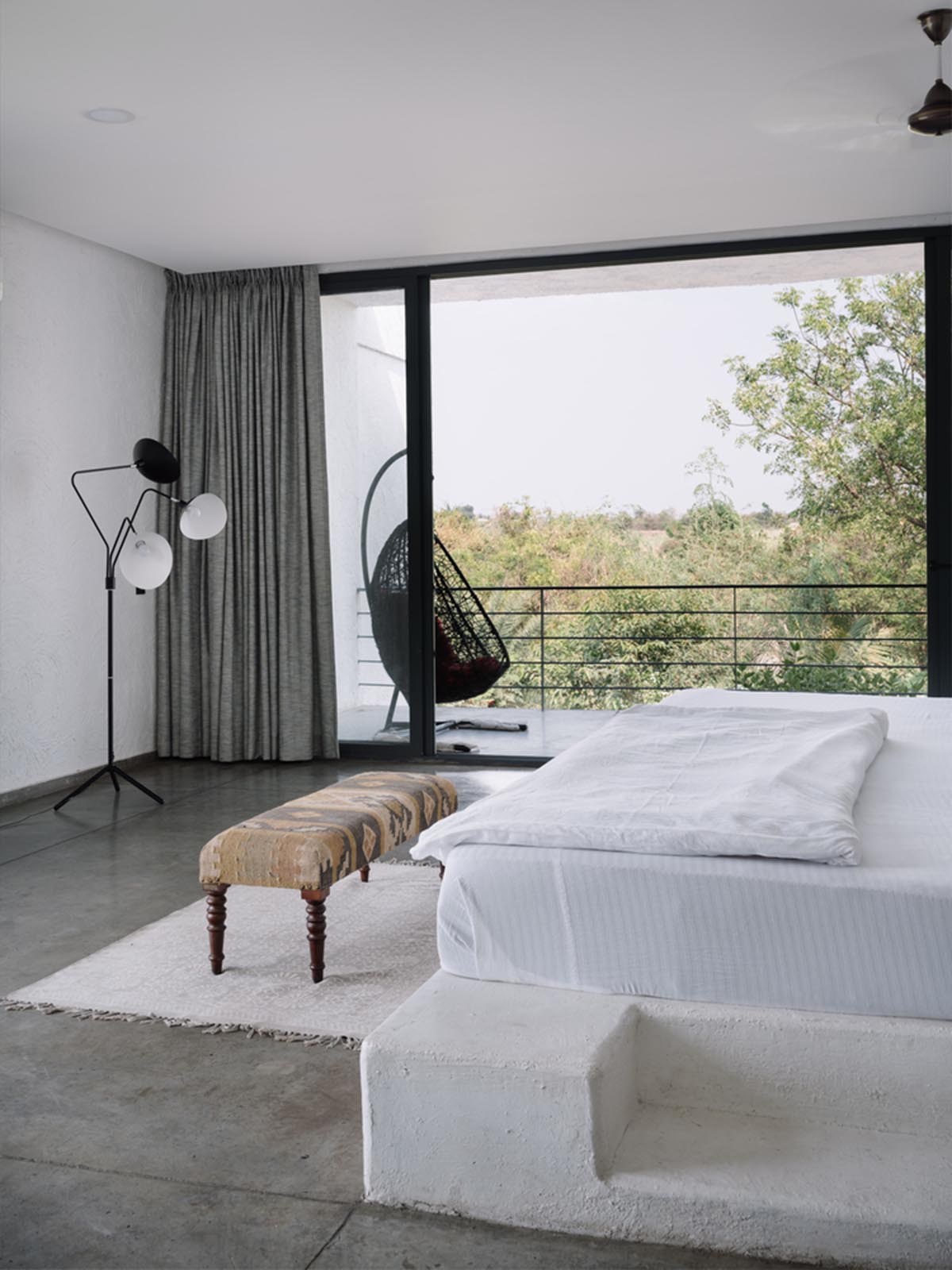 Weekend home is clad in bamboo screens that create a rustic appearance on the outskirts of Pune
