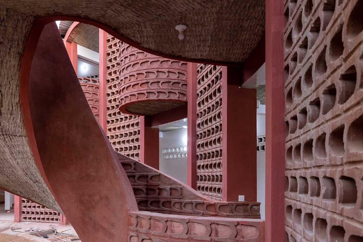 Manuel Herz Architects built curvilinear hospital with lattice-like brickwork in rural Senegal