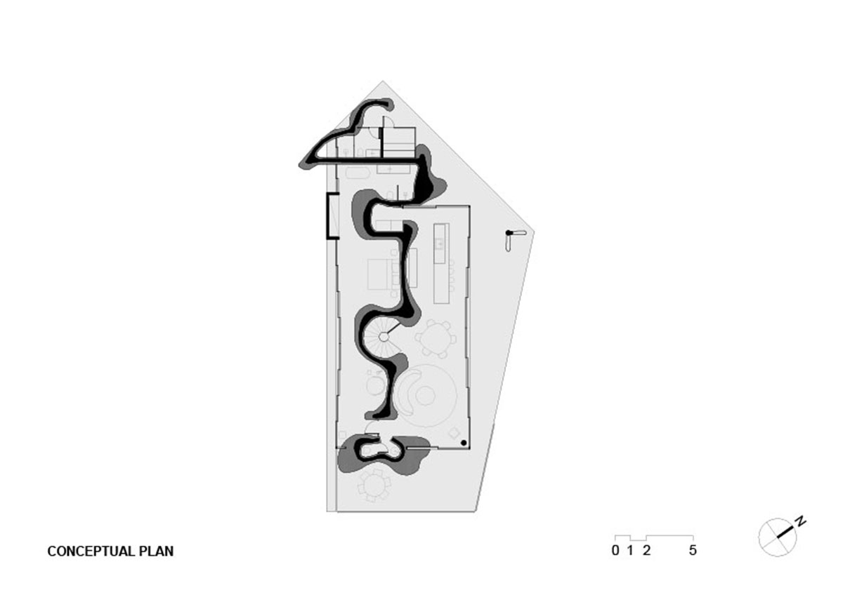 Seriema House is shaped around massive, black Portuguese stones for contemplation in Brazil