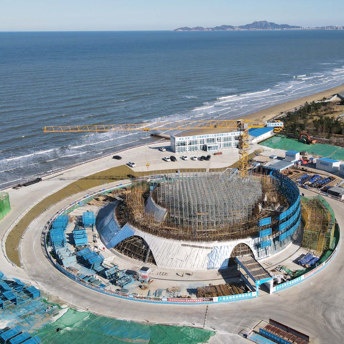 OPEN reveals its curvilinear Sun Tower with sliced silhouette on Yantai coast