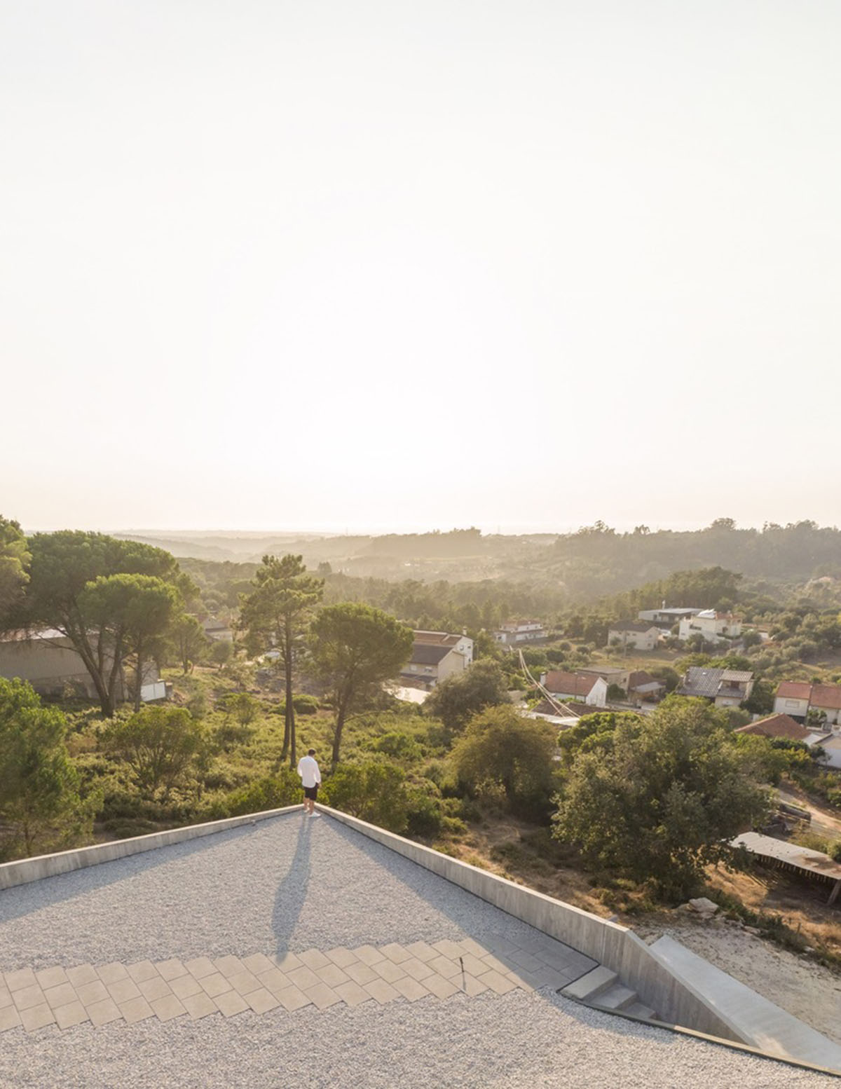Contaminar Arquitectos built cave-like house from irregular walls inspired by rocky topography