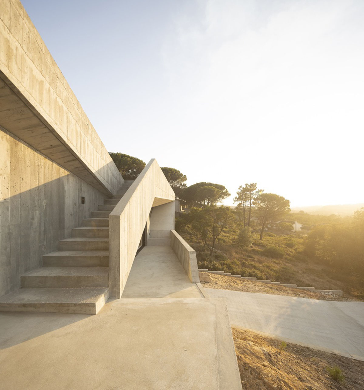 Contaminar Arquitectos built cave-like house from irregular walls inspired by rocky topography