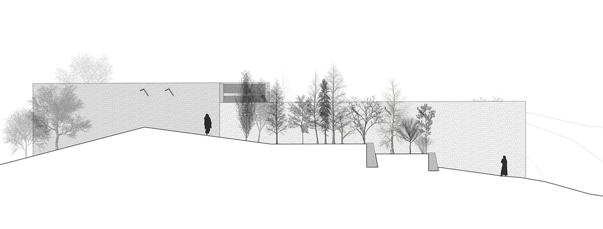 Two elongated walls made of granite rocks and earth form this women's house in a village of Morocco