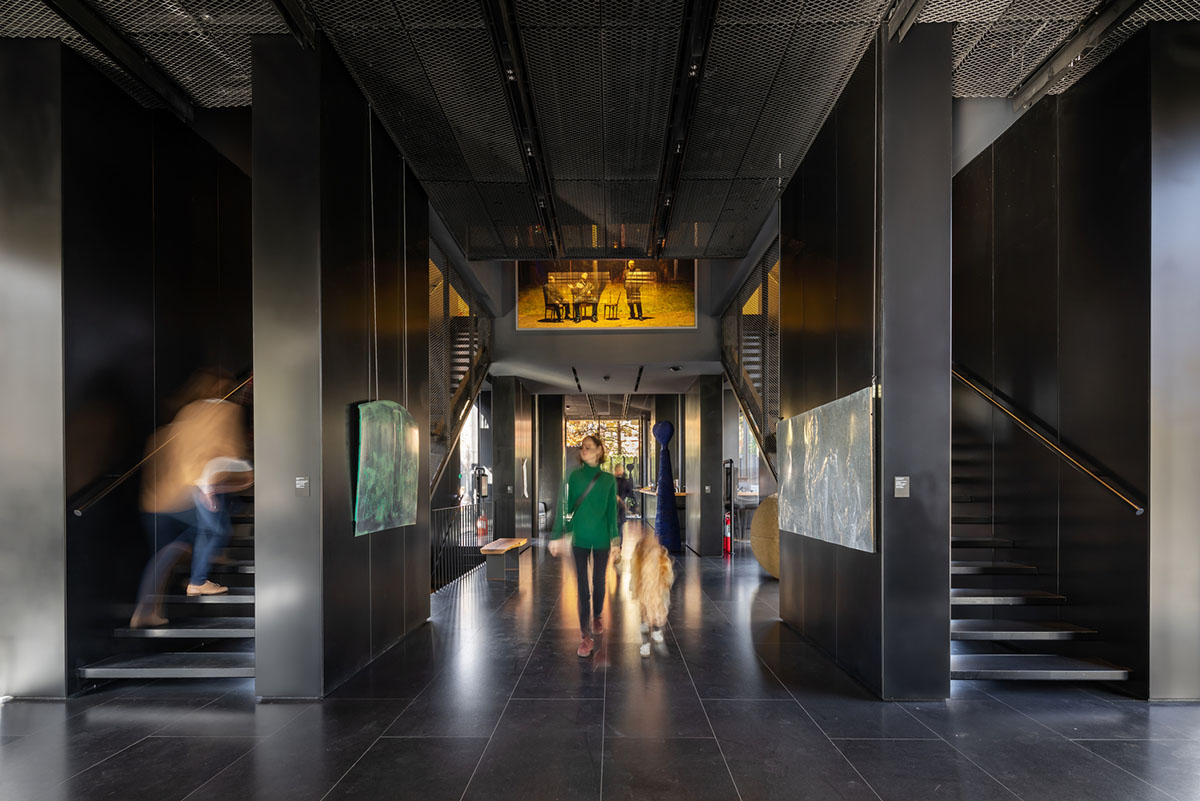 YTAA converts old villa into a museum with irregular dark surfaces and glazed base in Bucharest