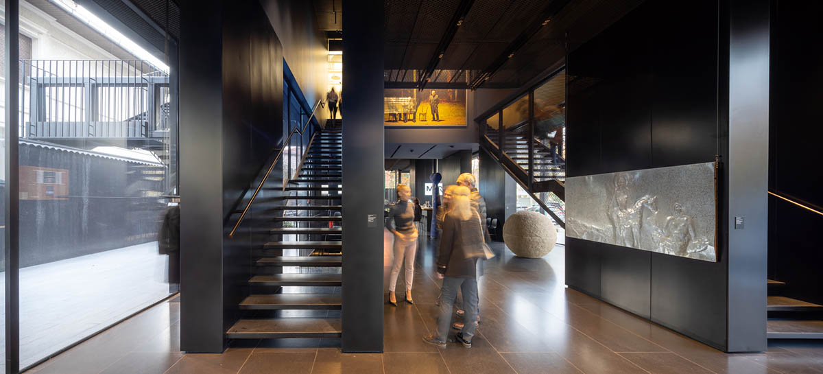 YTAA converts old villa into a museum with irregular dark surfaces and glazed base in Bucharest