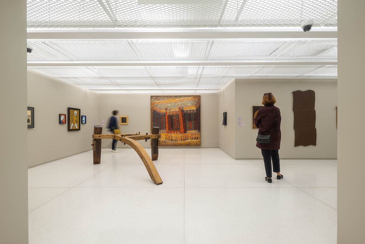 YTAA converts old villa into a museum with irregular dark surfaces and glazed base in Bucharest