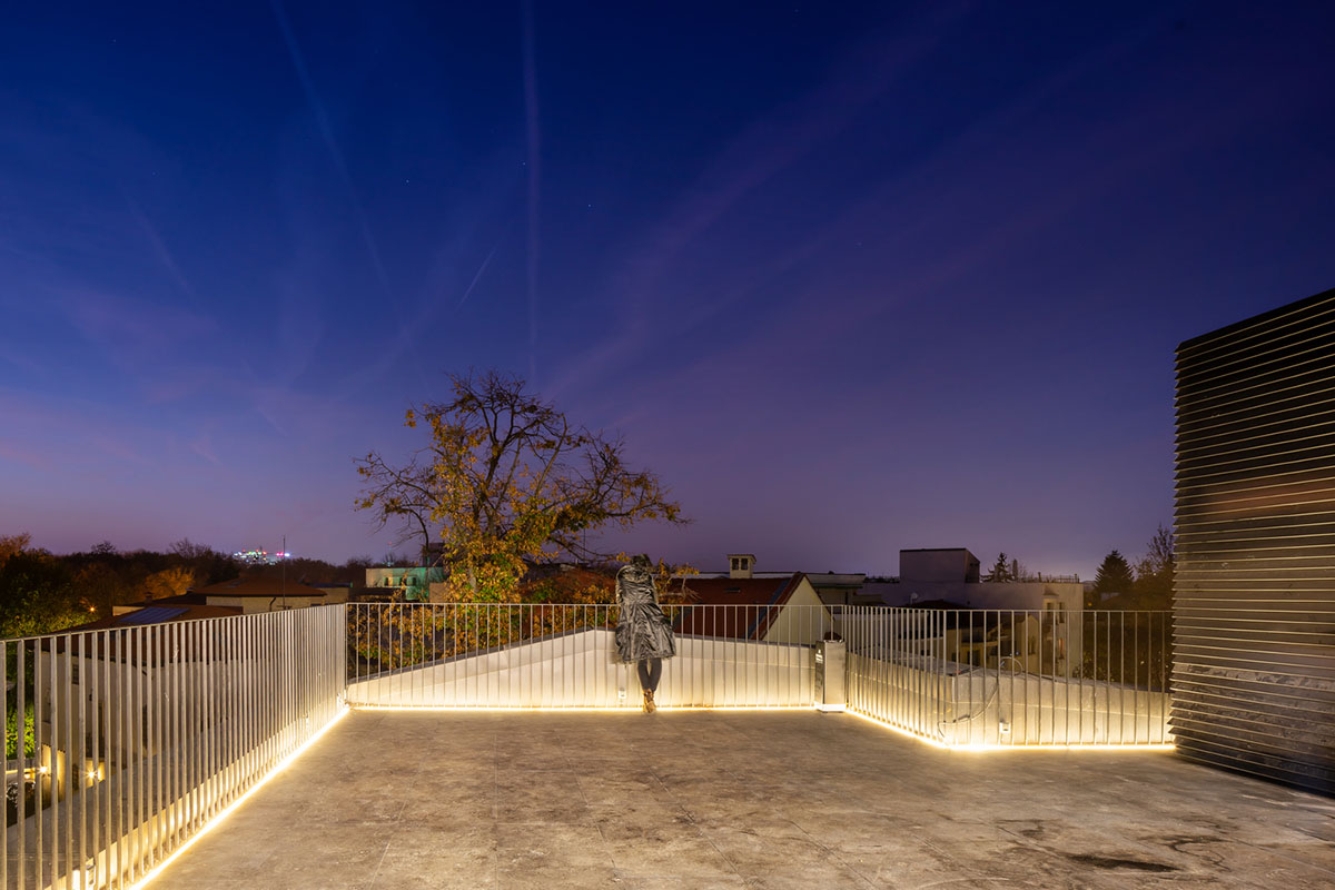 YTAA converts old villa into a museum with irregular dark surfaces and glazed base in Bucharest