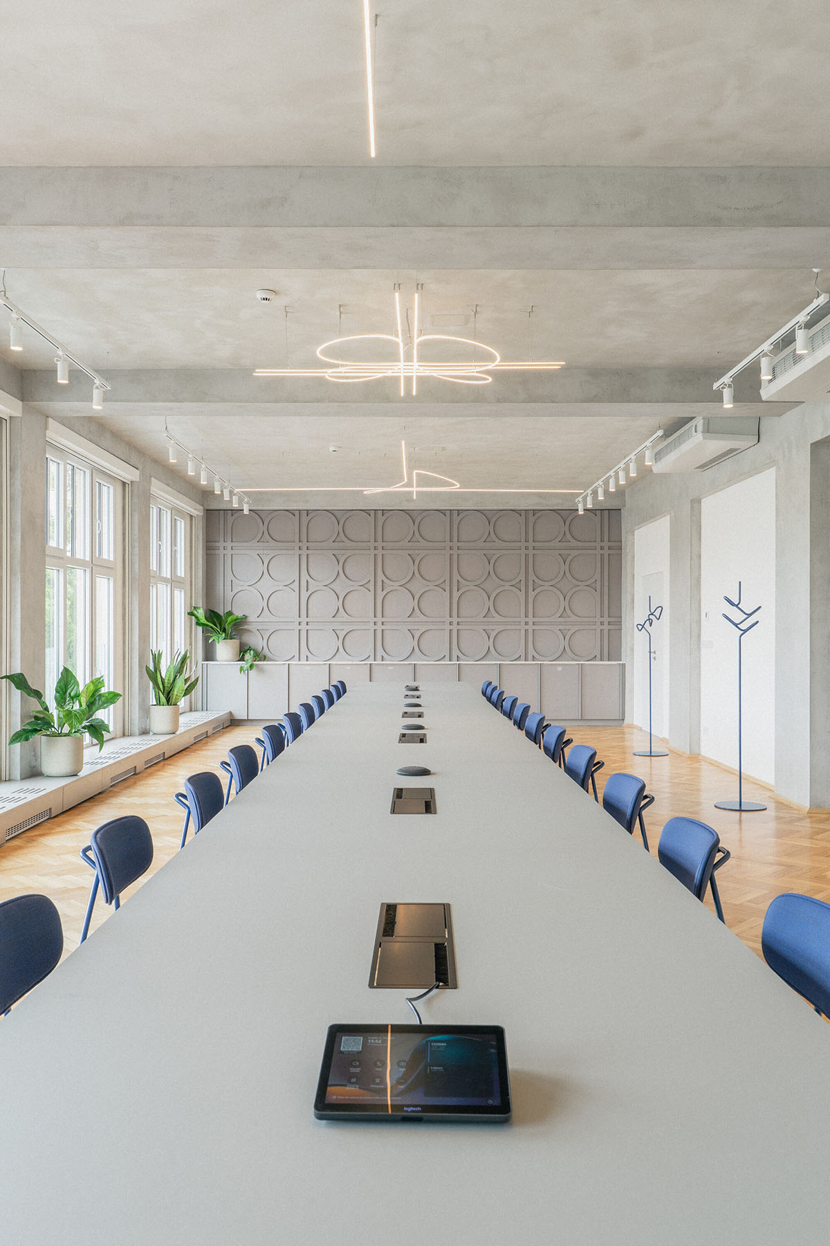 Studio Cosmo revitalizes Pudis offices featuring a stainless steel backdrop in Prague