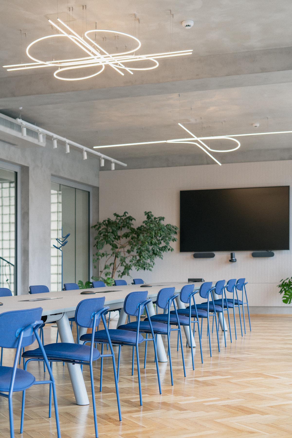 Studio Cosmo revitalizes Pudis offices featuring a stainless steel backdrop in Prague