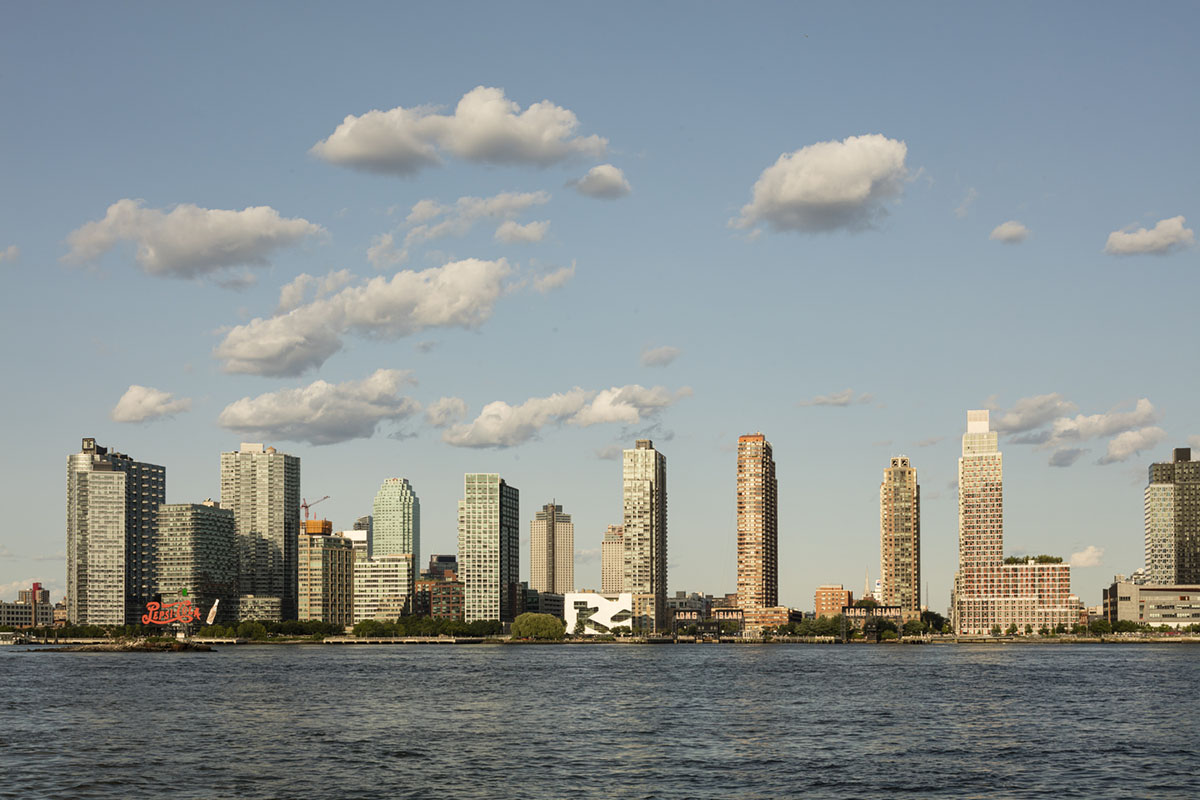 Steven Holl Architects completes Hunters Point Library with flowing sculpted cuts in New York