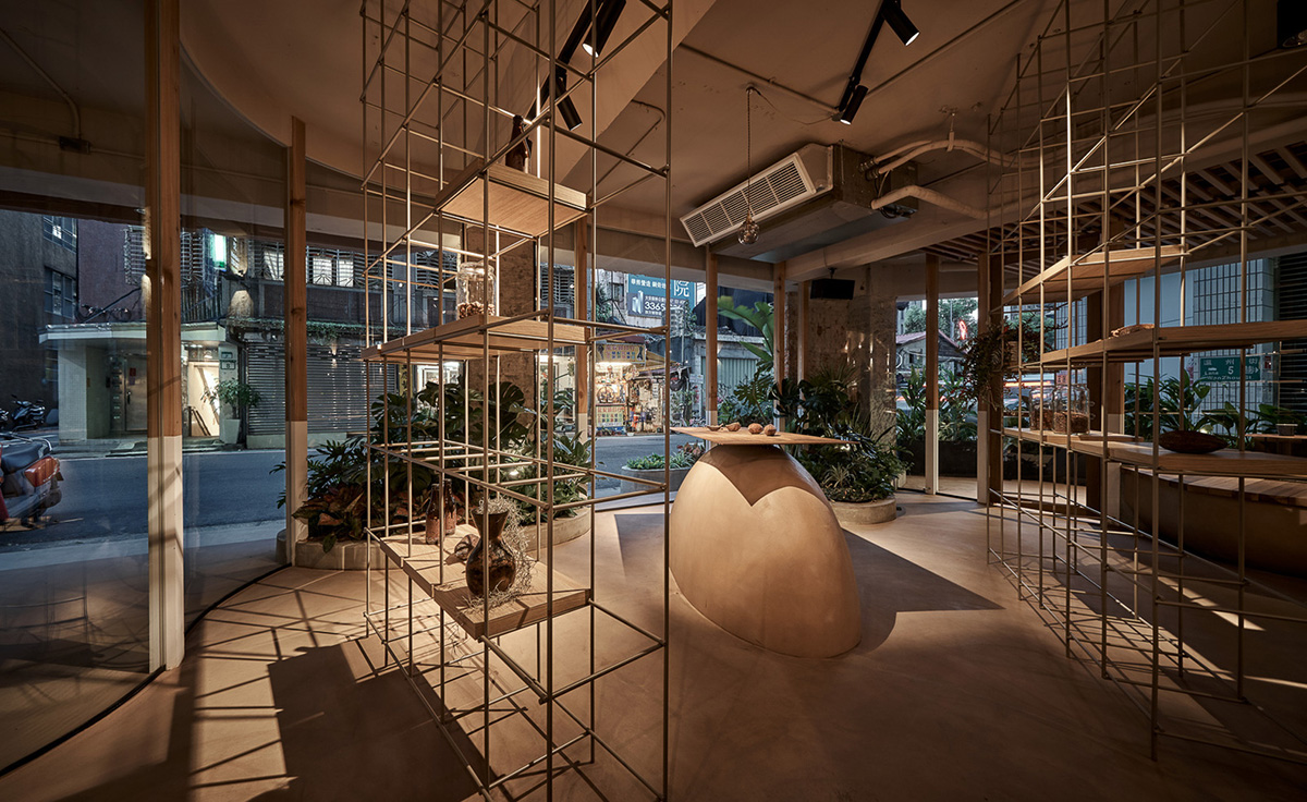Soar Design Studio adds greenery and smooth surfaces to chocolate store offering garden-like space