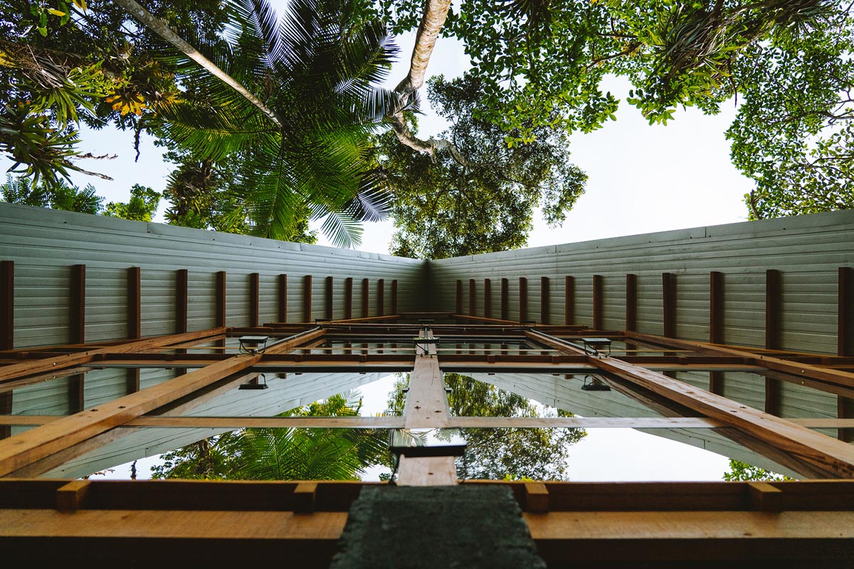 Macaco House is lifted on pillars to have zero interference in vegetation of Brazilian forest