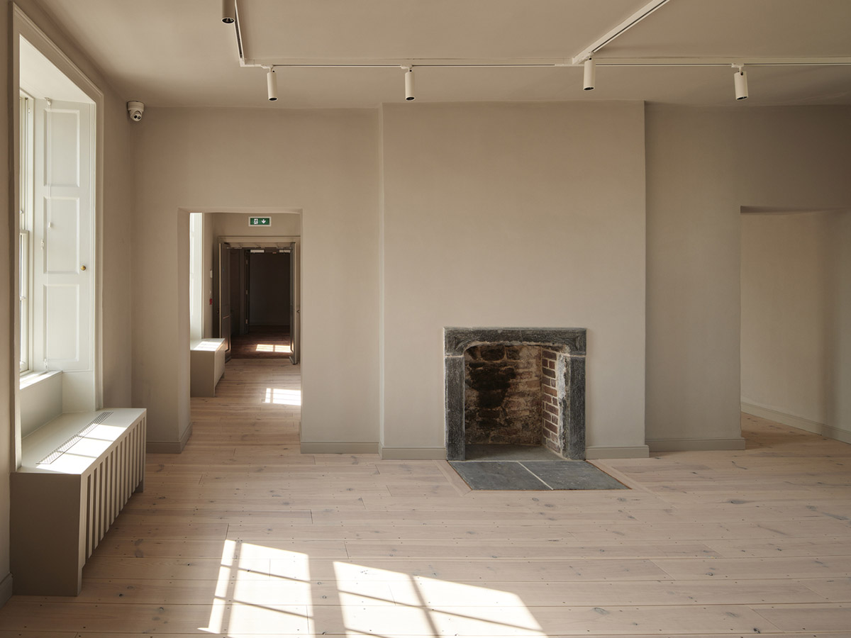 Mccullough Mulvin Architects adds two metal-clad volumes to convert former almshouse into art gallery