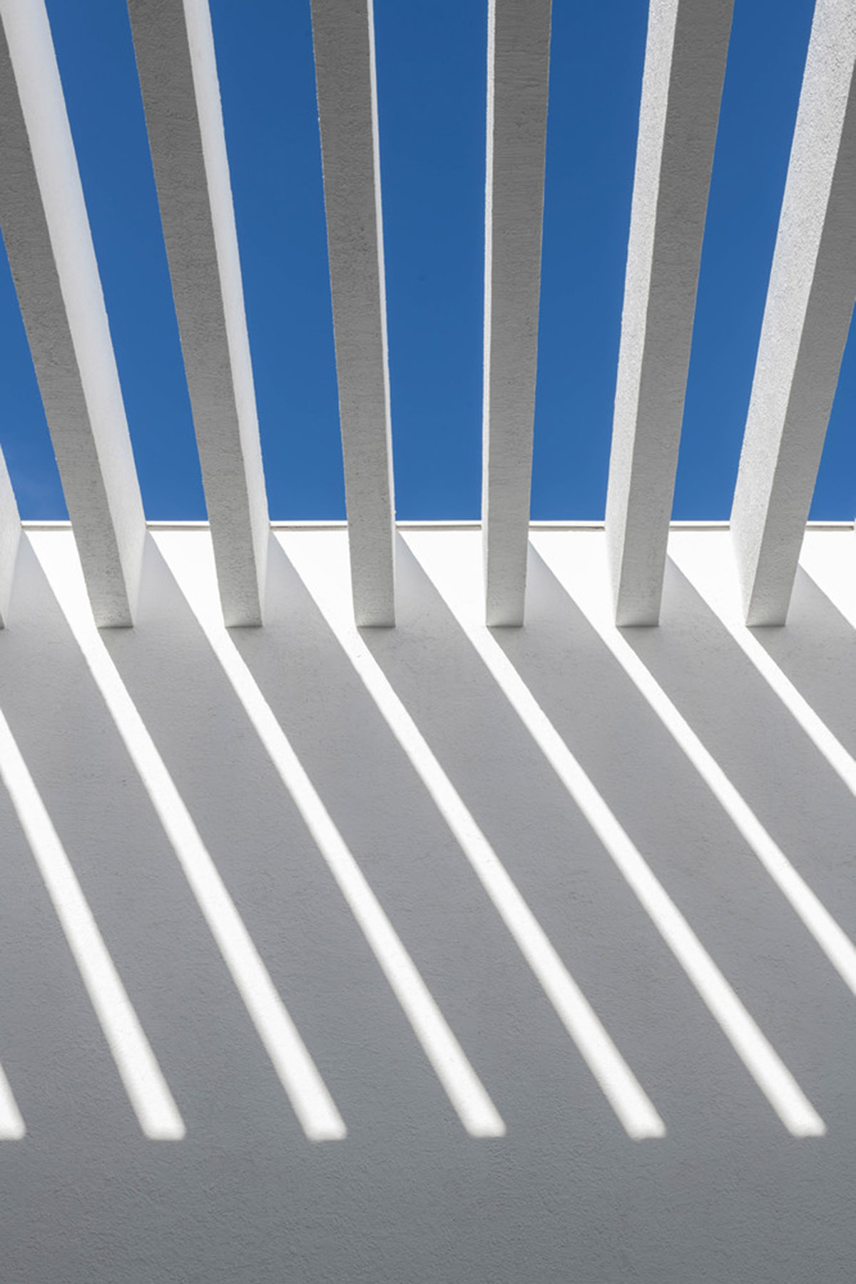 Cadaval & Solà-Morales' white excavated house features porous interior that expands activities